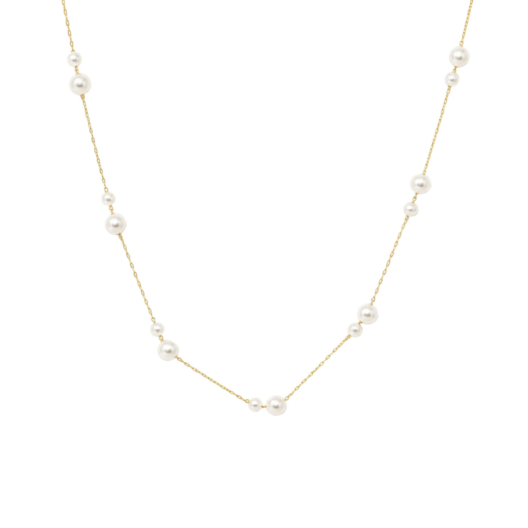 Dainty gold chain necklace with evenly spaced floating pearl stations.