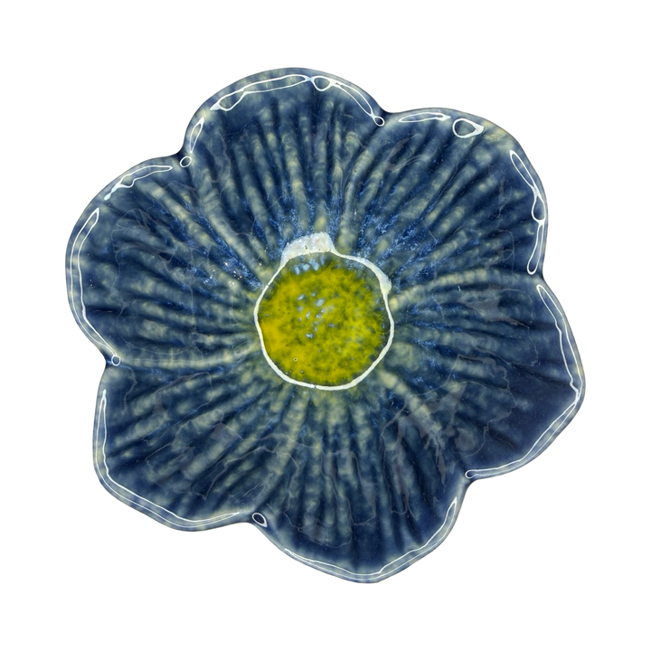 Stoneware flower-shaped bowl in navy blue with a golden center glaze.