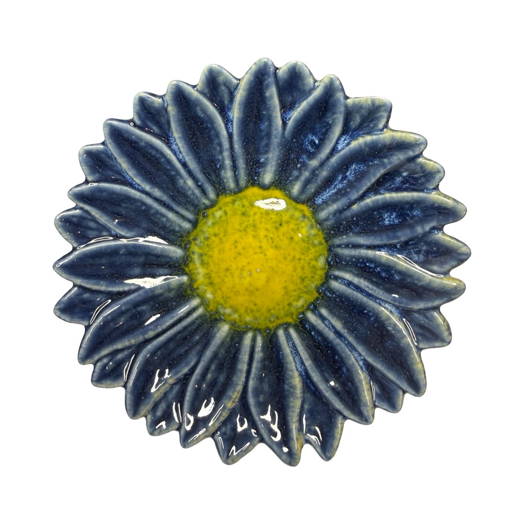 Stoneware flower-shaped dish in dark blue with a yellow center glaze