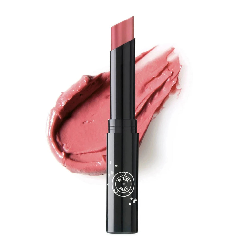 black branded tube of pink shade lipstick with a color swatch behind it. Brand: Rituel De Fille
