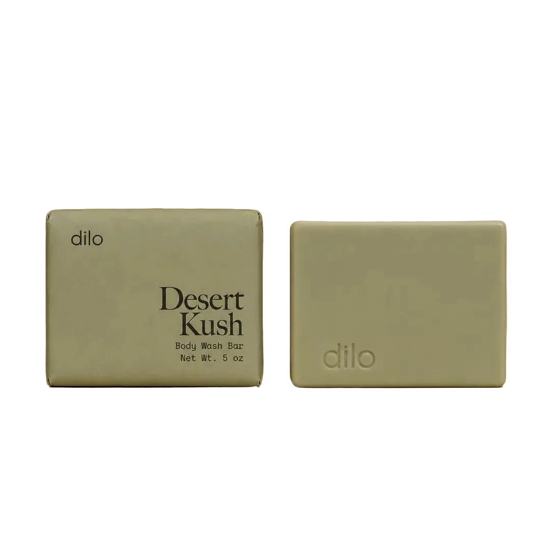 Dilo Desert Kush body wash bar with sage green packaging shown alongside the unwrapped soap bar.