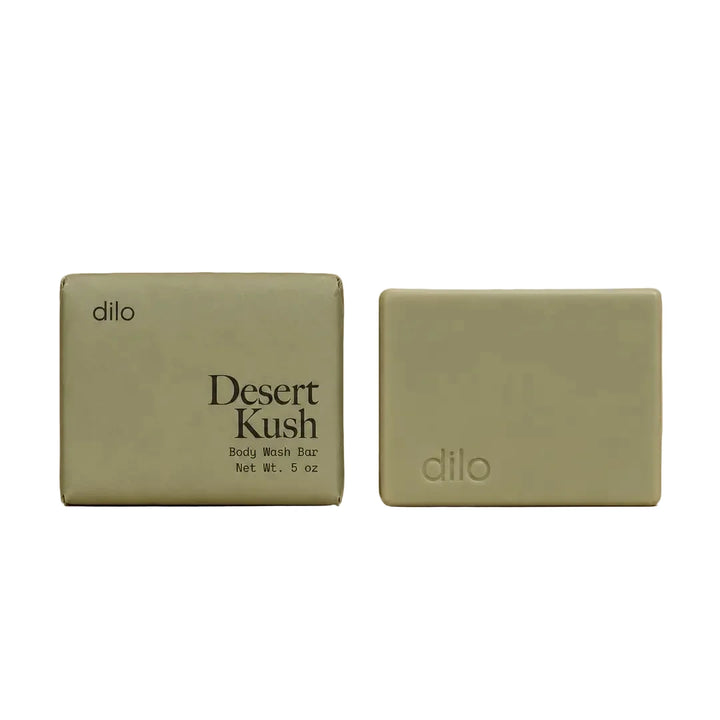 Dilo Desert Kush body wash bar with sage green packaging shown alongside the unwrapped soap bar.