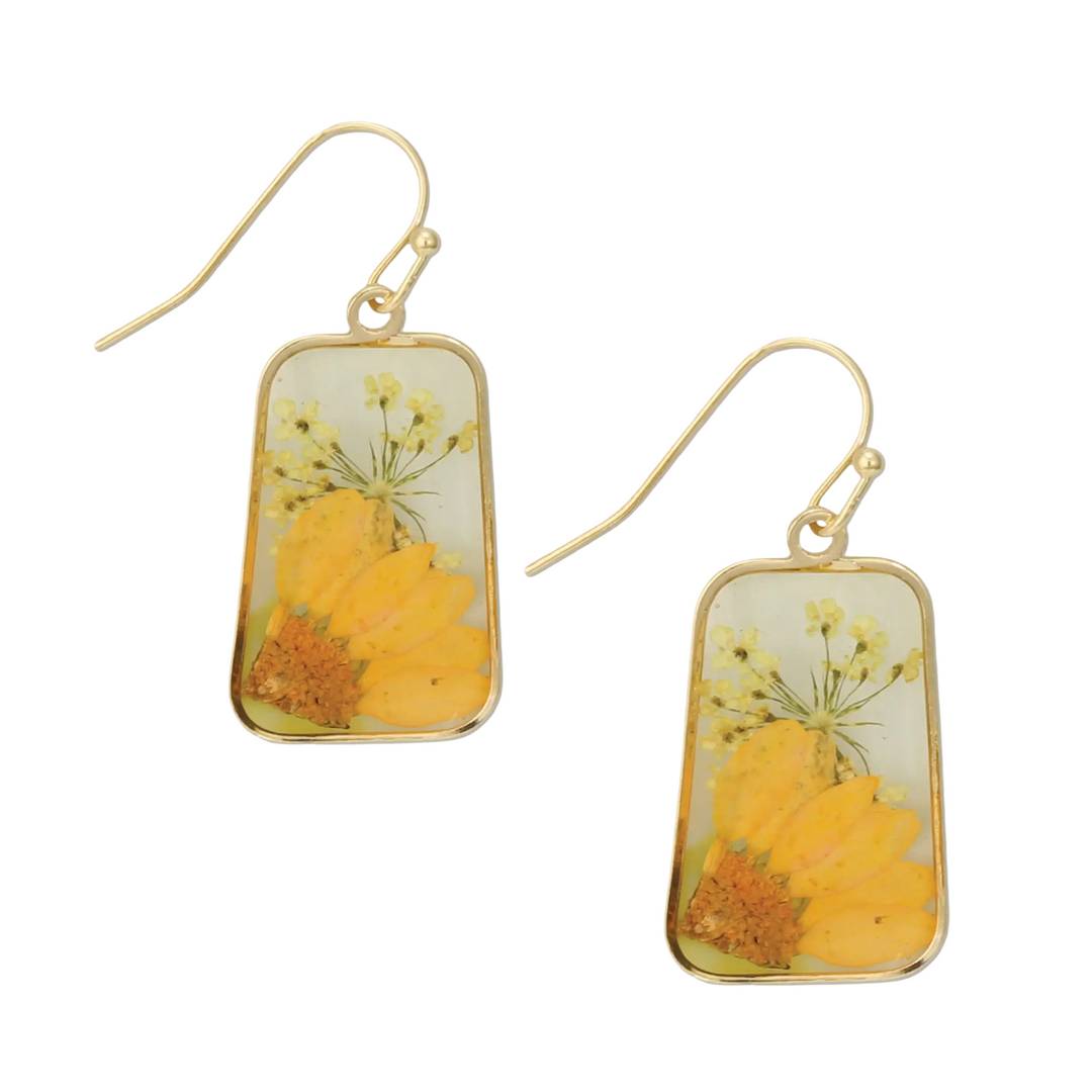 Pair of dandle earrings feature yellow botanical design with gold hardware.
