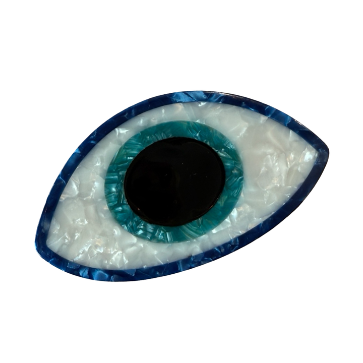 Shiny Evil Eye hair barrette with blue, turquoise, white, and black detailing, shaped like an eye.