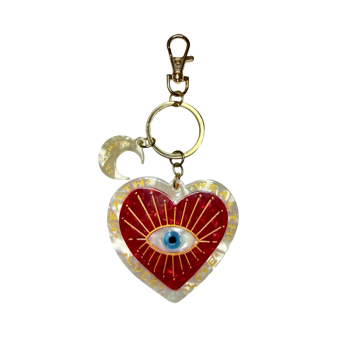Heart shaped keychain with an evil eye design and moon charm