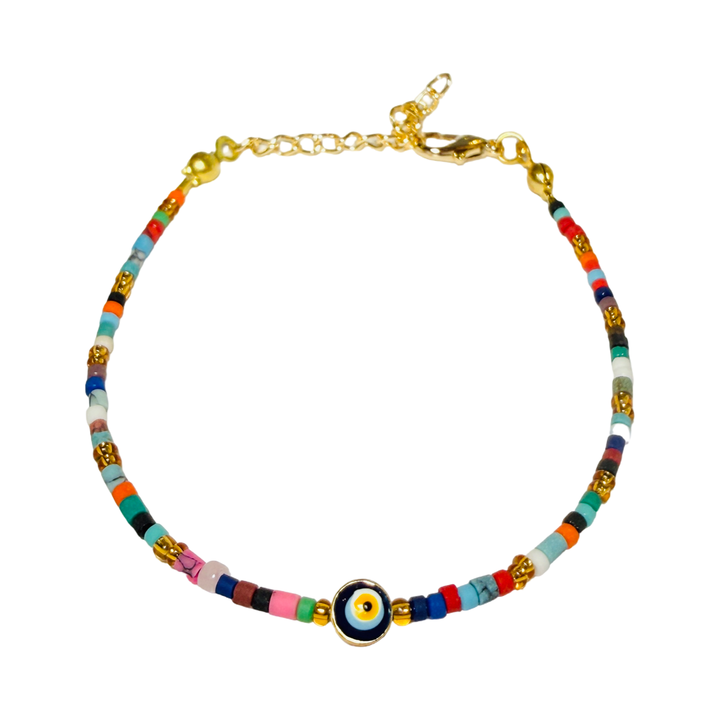 A delicate multicolor seed bead bracelet with a gold evil eye charm centerpiece and a gold lobster clasp closure.