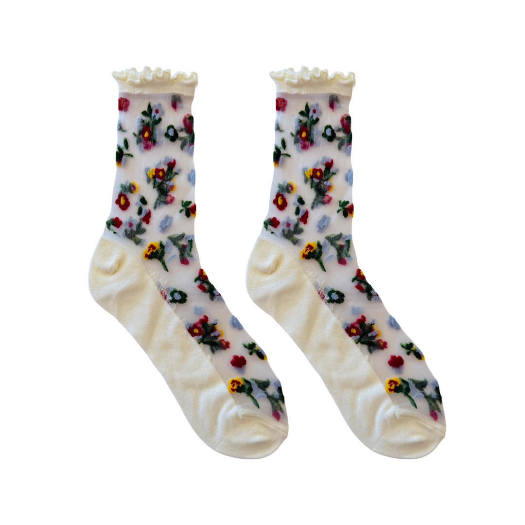 Sheer floral mesh socks with embroidered flowers and a solid foot and cuff.
