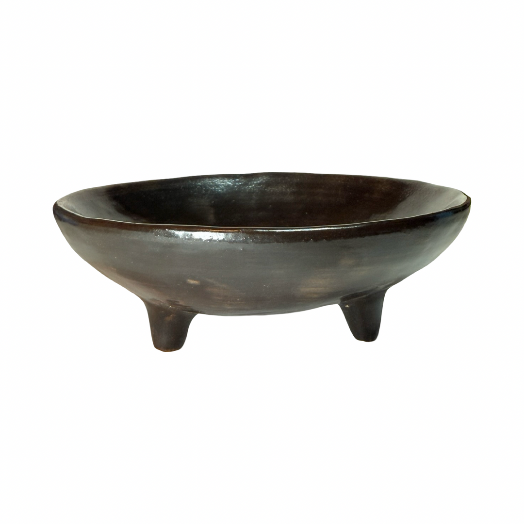 Dark brown dish with legs.