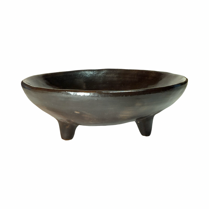 Dark brown dish with legs.