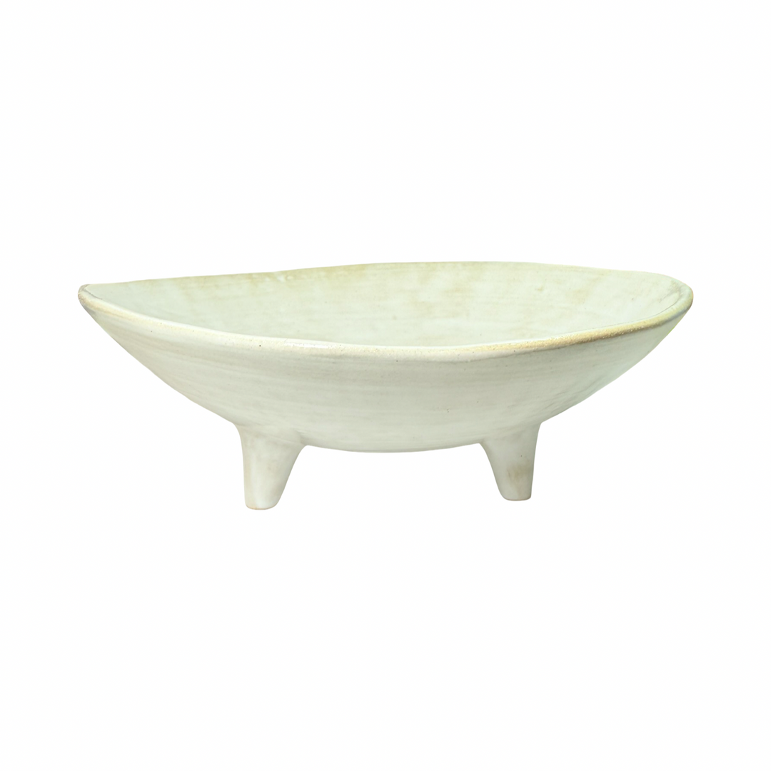 white ceramic dish with three legs.