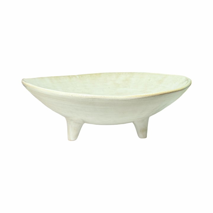 white ceramic dish with three legs.