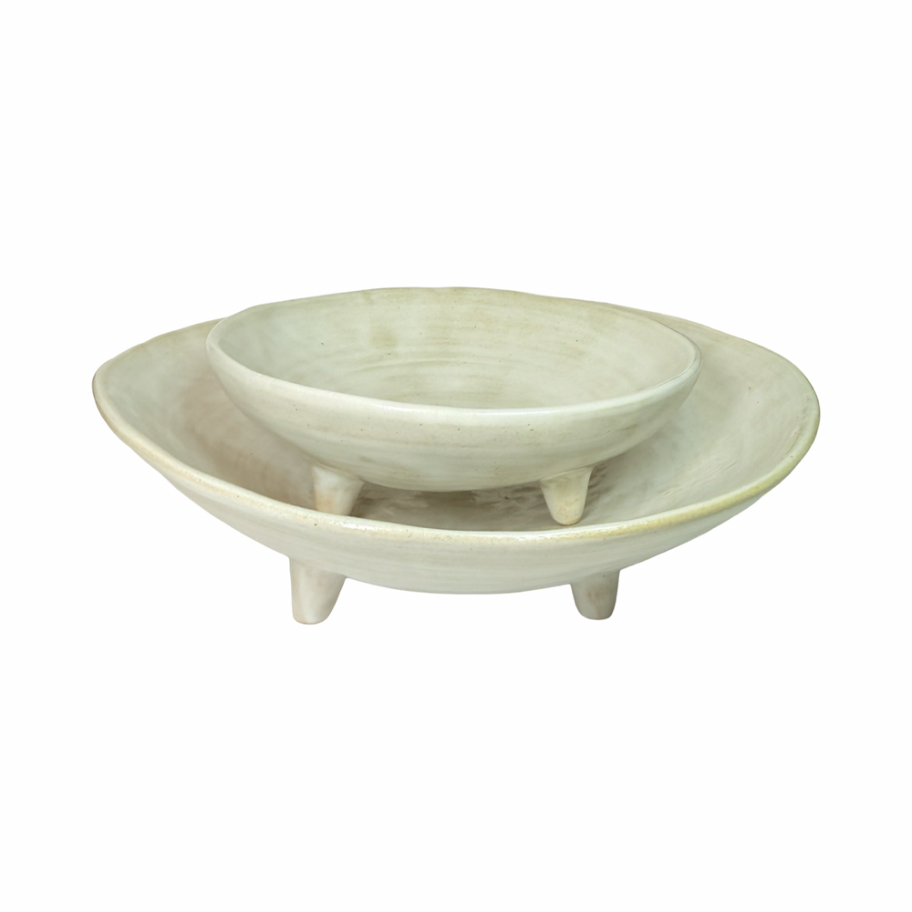 set of white ceramic dishes of two different sizes with one sitting atop of the other