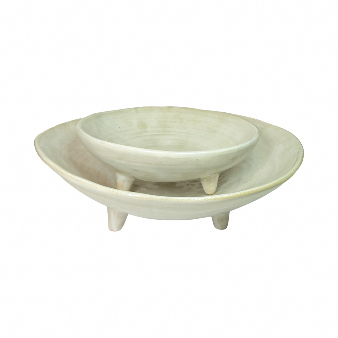 set of white ceramic dishes of two different sizes with one sitting atop of the other
