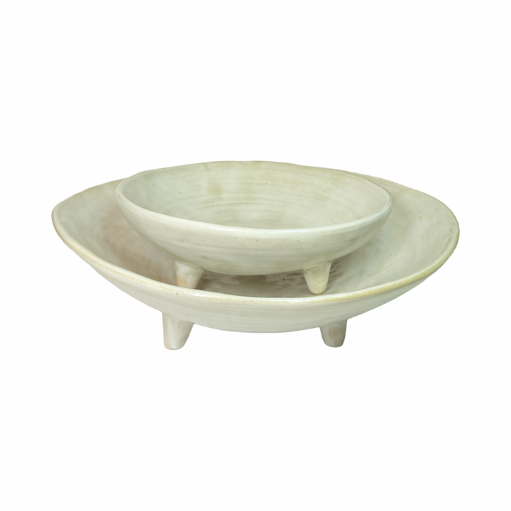 set of white ceramic dishes of two different sizes with one sitting atop of the other
