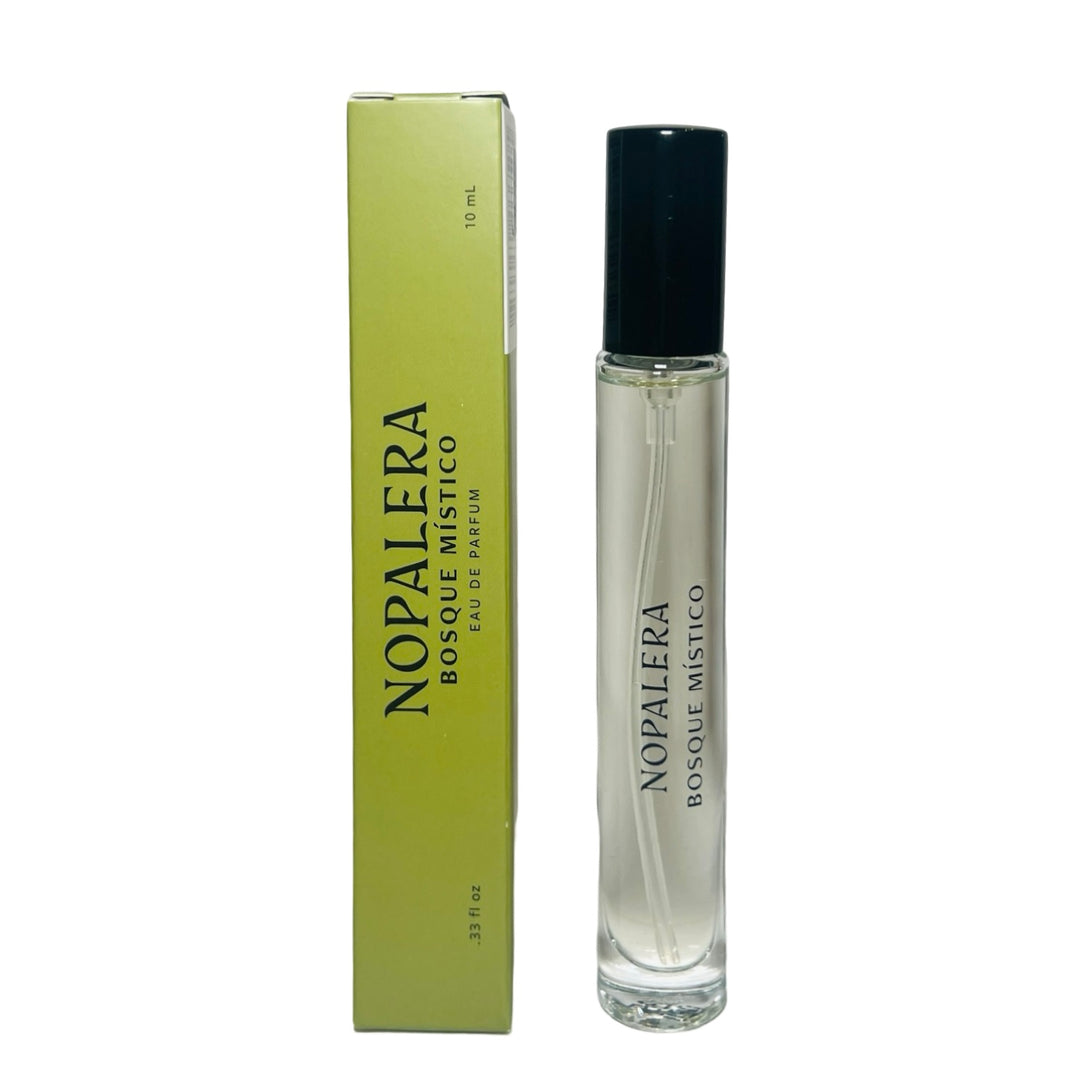 clear 10ml jar with a black top flanked by a sage green branded box of Bosque Mistico Nopalera perfume