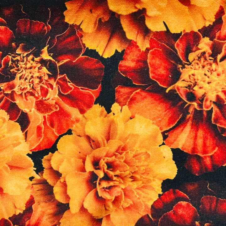 close up view of a kitchen towel featuring a realistic marigold image