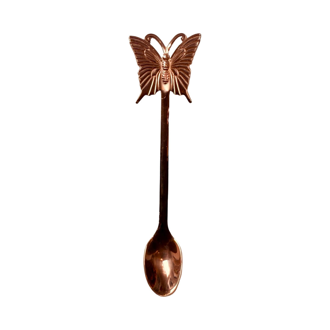 rose gold spoon with a butterfly on the end.