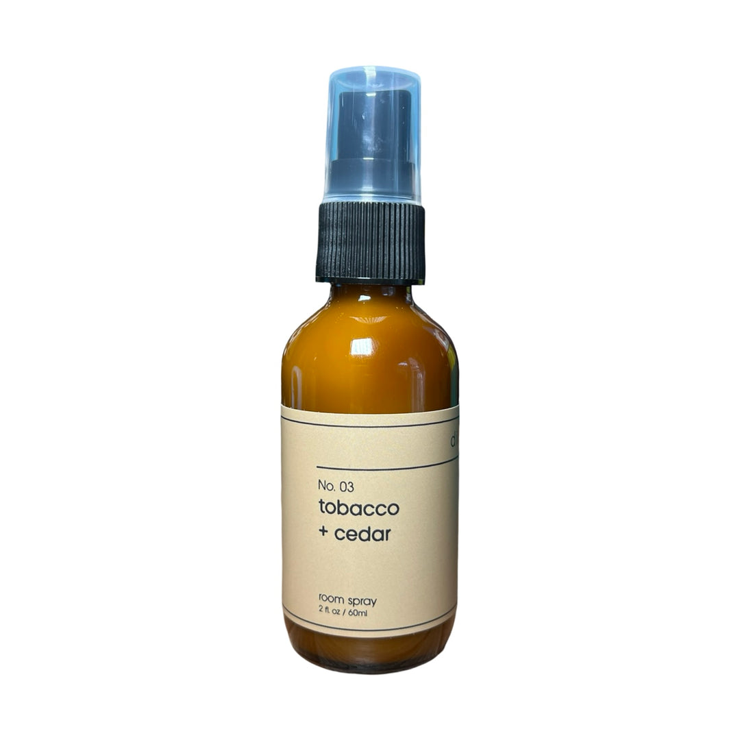 2oz brown spray bottle of tobacco and cedar room spray