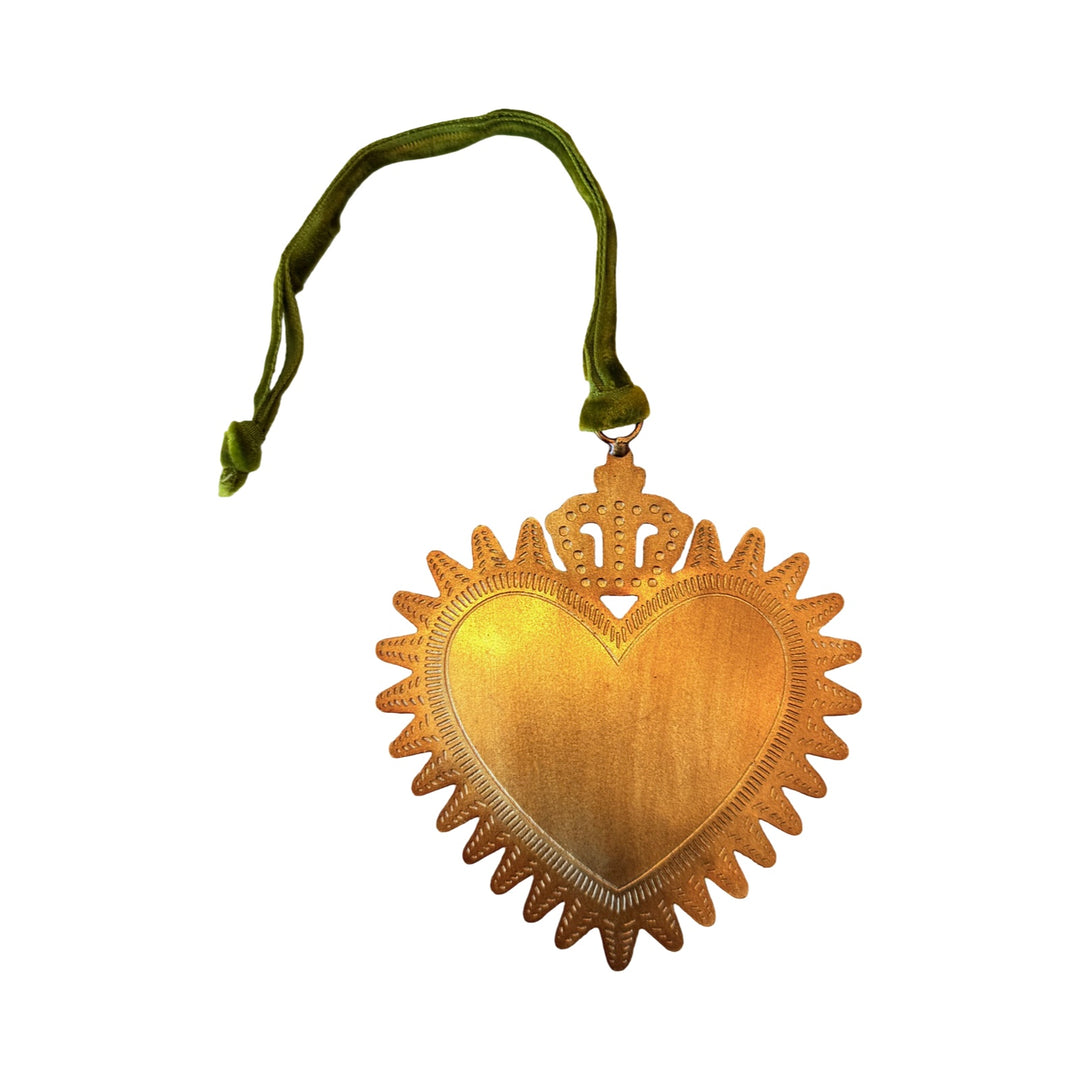 Small gold toned sacred heart with a crown on top and a green velvet loop for hanging.