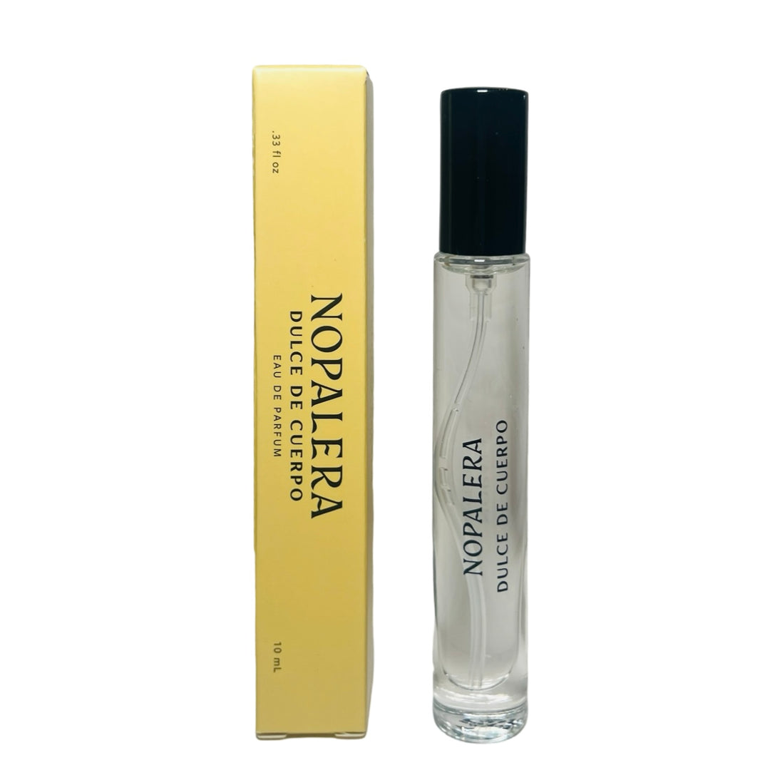 clear 10ml jar with a black top flanked by a yellow branded box of Dulce De Cuerpo Nopalera perfume