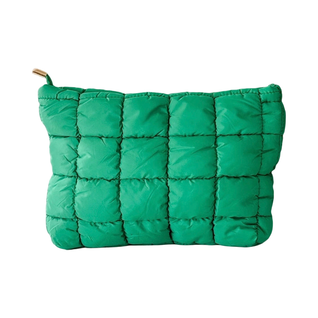 Quilted puffer makeup bags in green with a textured, padded exterior.