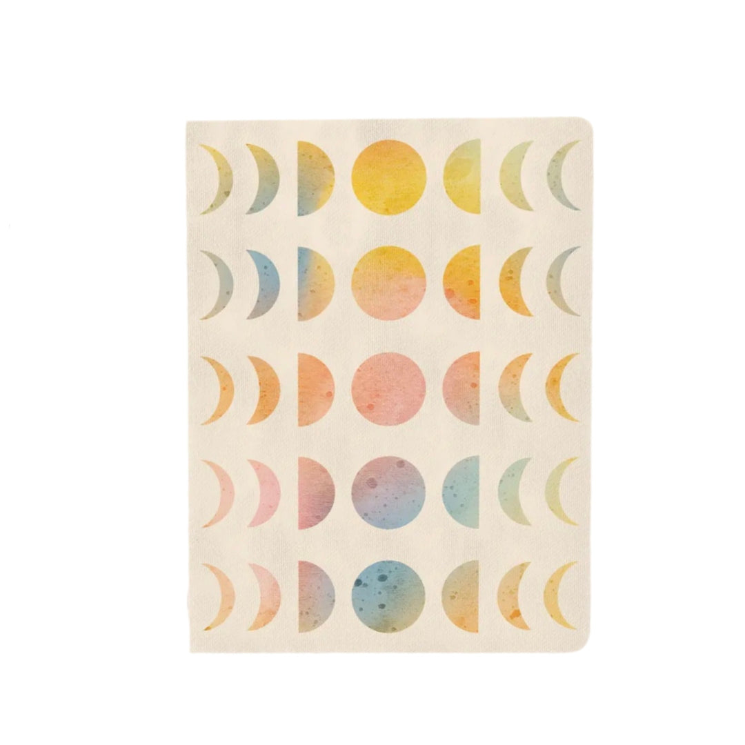 beige journal with pastel colored illustrations of moon in various moon phases