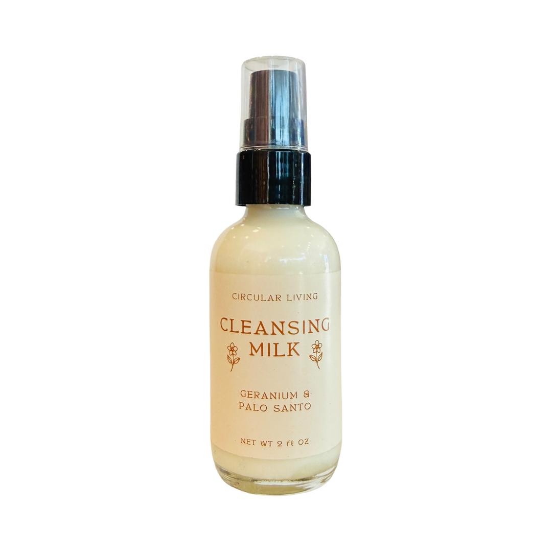 A 2 oz pump bottle of Circular Living Cleansing Milk in Geranium and Palo Santo scent with a cream label and gold lettering.
