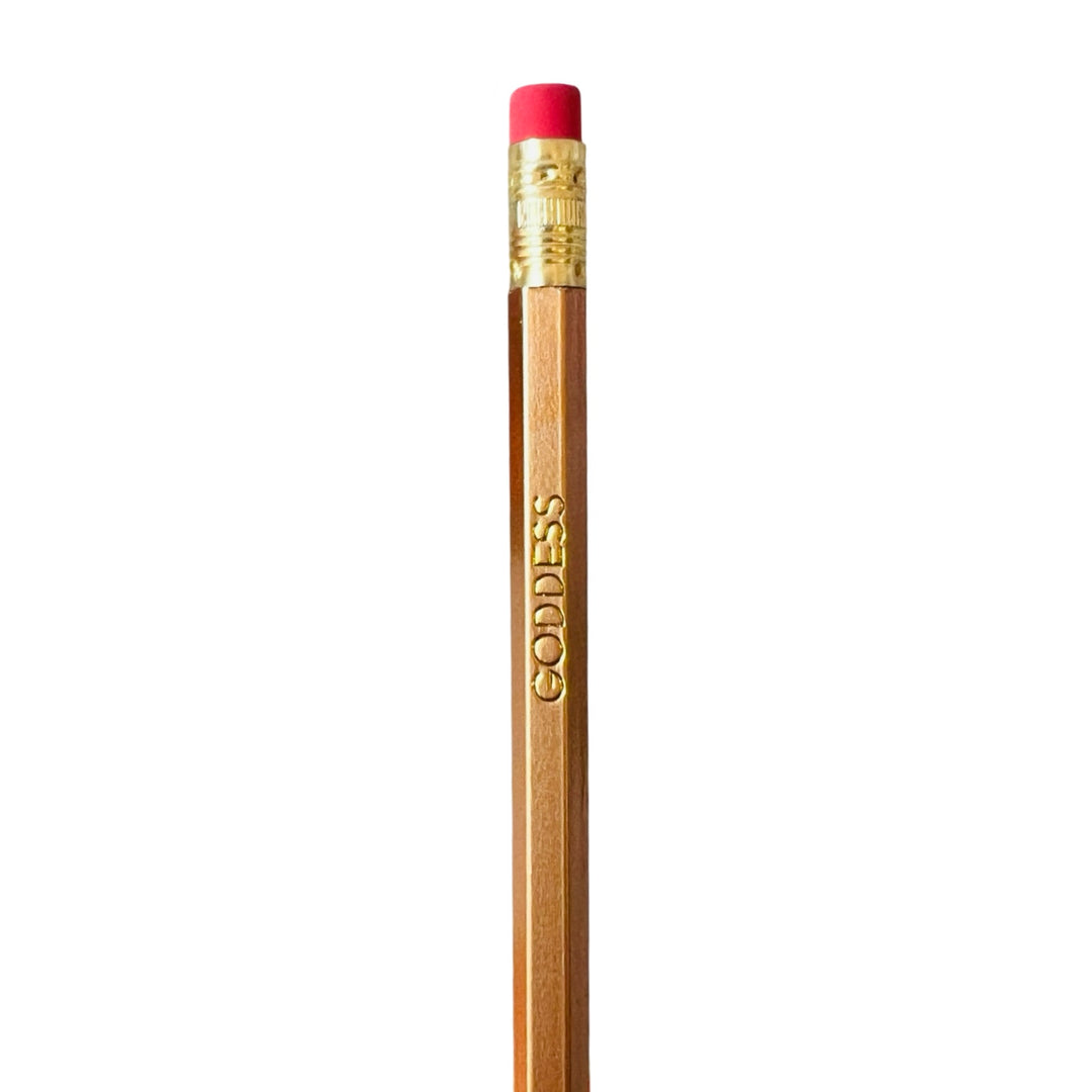 A wooden pencil with 'GODDESS' printed in gold lettering on the side, topped with a red eraser.
