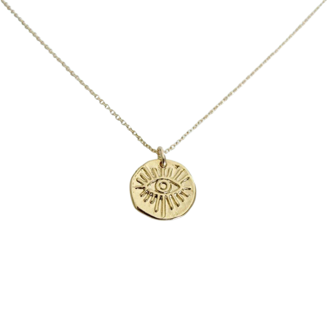 gold medallion with an image of an eye on a gold chain