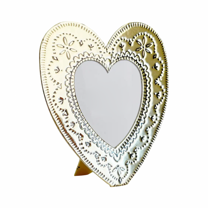 Faux tin gold heart shaped frame with embossed floral details.