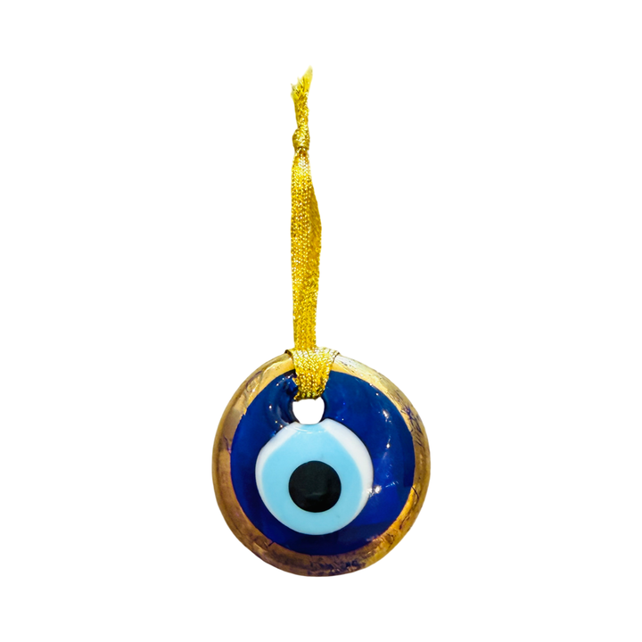 Gold trimmed blue and white glass evil eye charm.