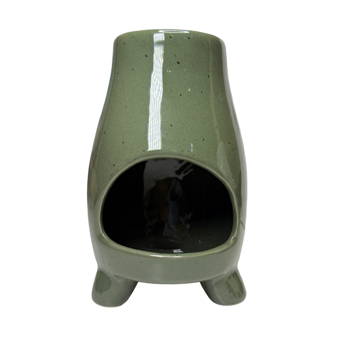 Speckled green ceramic planter with a small opening on a white background.