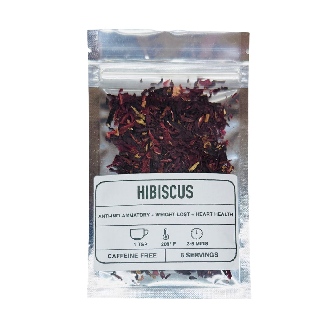Foil and clear plastic envelope full of red hibiscus leaves with label listing contents and preparation instructions.