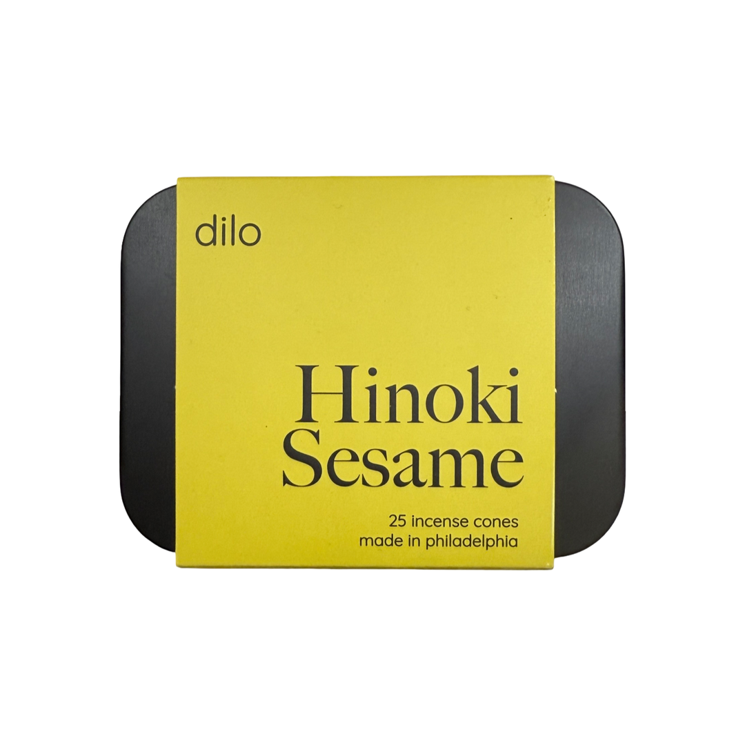 Black tin of Hinoki Sesame incense cones with a yellow sleeve