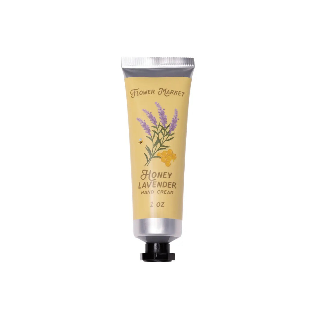 A 1 oz tube of Honey Lavender Hand Cream with a yellow label featuring illustrations of lavender sprigs, honeycomb, and a small bee.