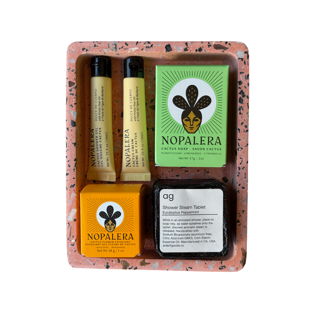 Casa Palma Dulce Gift Set featuring a beautifully arranged collection of self-care items, including Nopalera Cactus Soap and Exfoliant, Dulce De Cuerpo Cactus Cream, a Eucalyptus Peppermint Shower Steamer, a Palo Santo stick, and a Clay Terrazzo Tray.