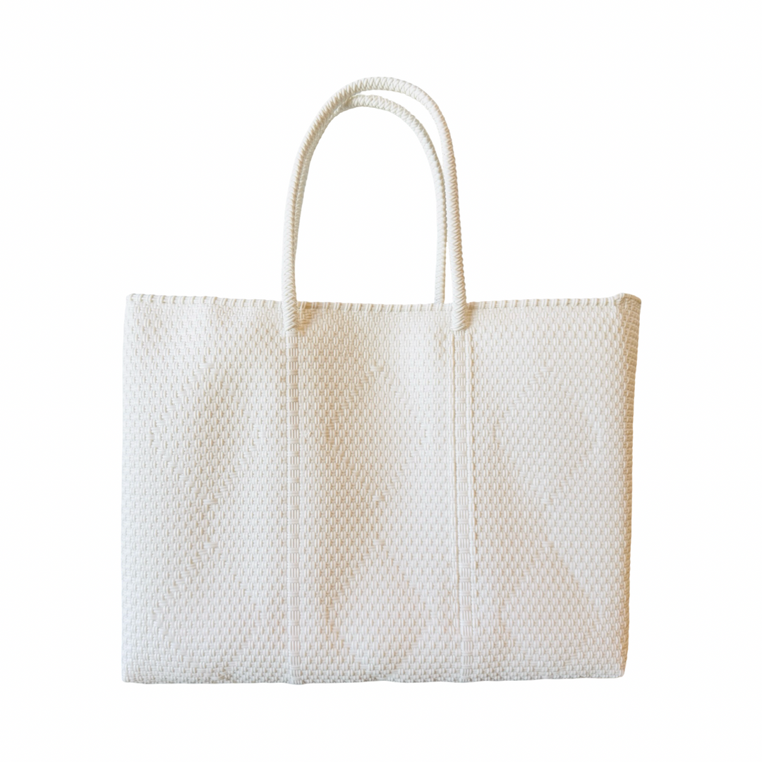 white recycled plastic woven tote featuring a unique weaved pattern and braided handles.