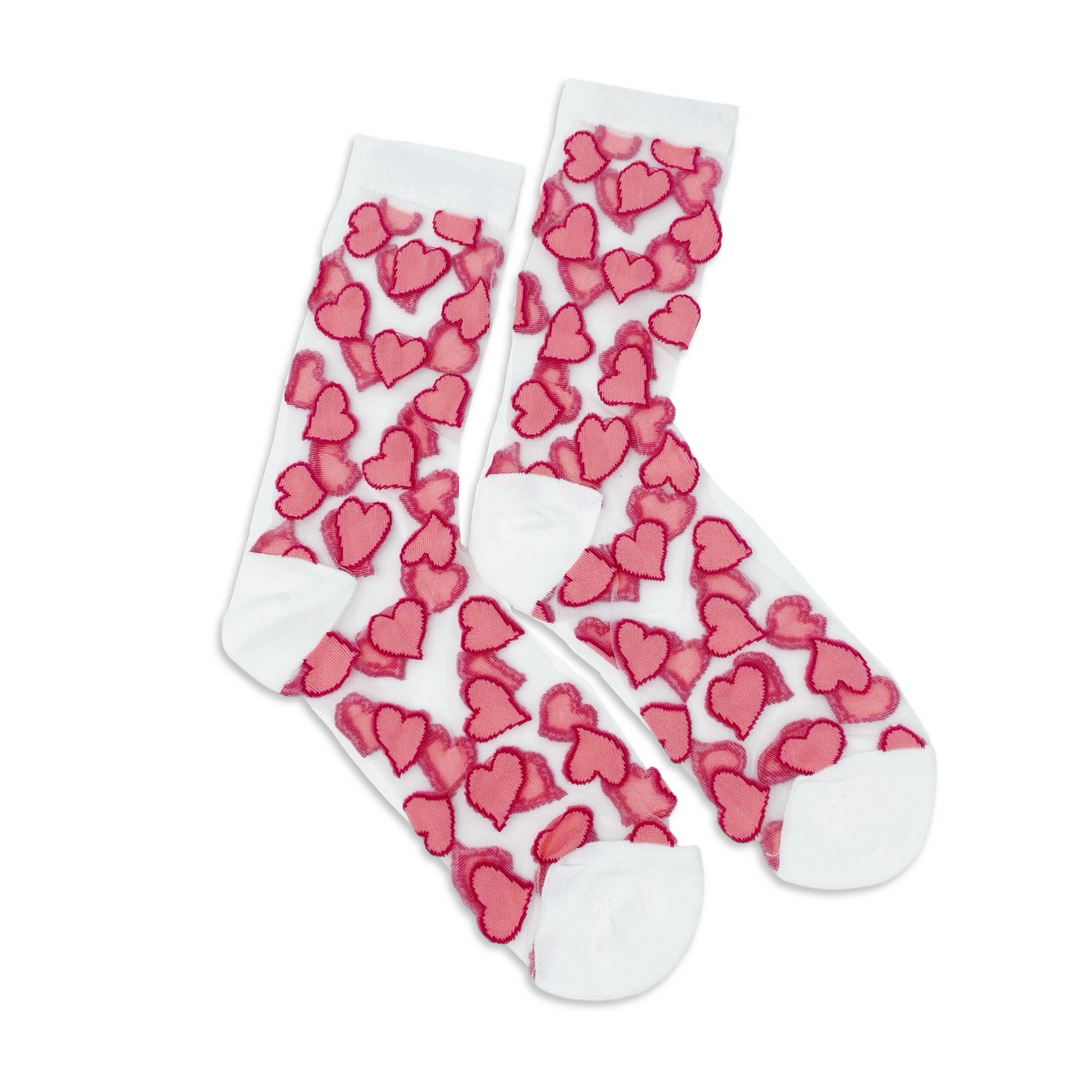 A pair of sheer socks covered with vibrant pink heart designs, featuring white toe and heel accents, laid flat on a white background.