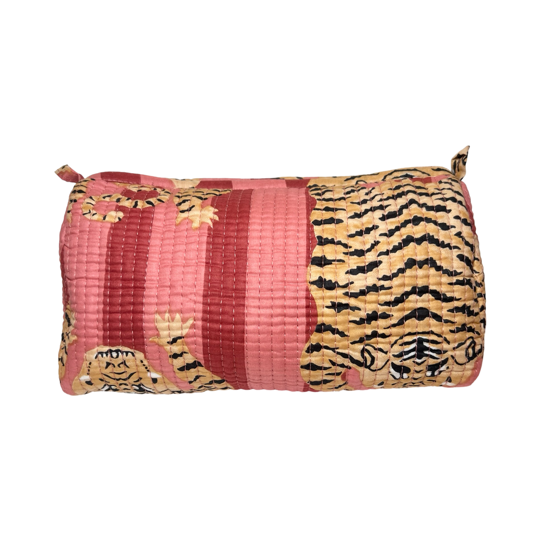 a cosmetic bag featuring a coral and pink and tiger-striped pattern.