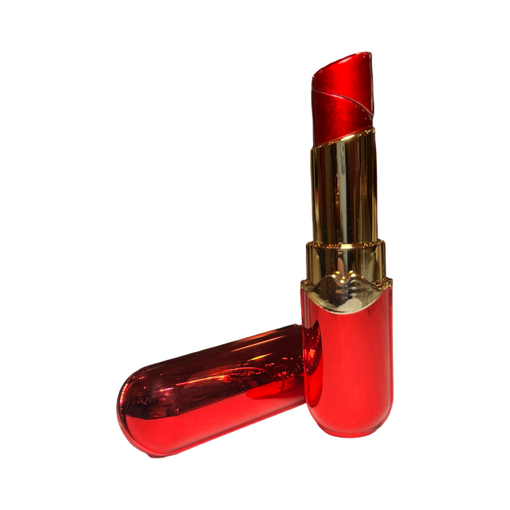 A refillable lighter designed to look like red lipstick, featuring a glossy red and gold case with the cap removed and placed beside it.