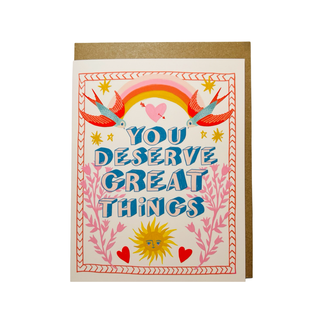 A colorful greeting card with the text "You Deserve Great Things" surrounded by a rainbow, birds, hearts, and a sun illustration.