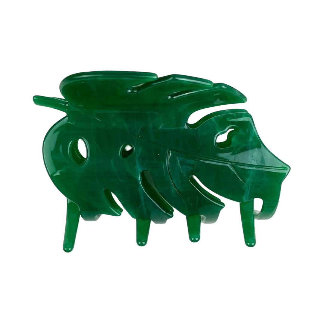 side view of a green monstera hair claw clip