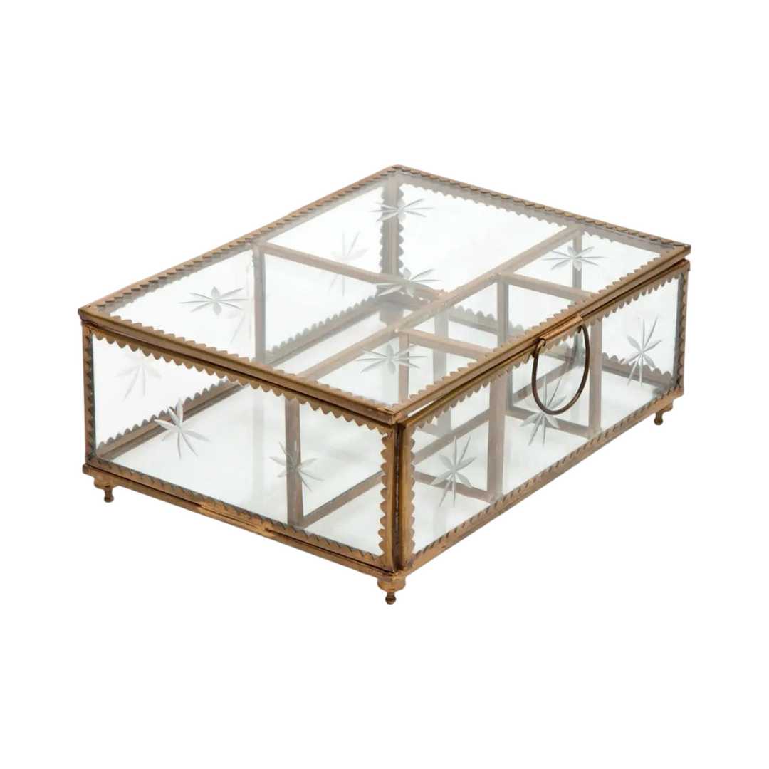 A rectangular trinket box with an antique brass frame and clear glass panels featuring etched starburst designs. The box has a hinged lid with a delicate latch, and its scalloped brass edges enhance its vintage-inspired charm.