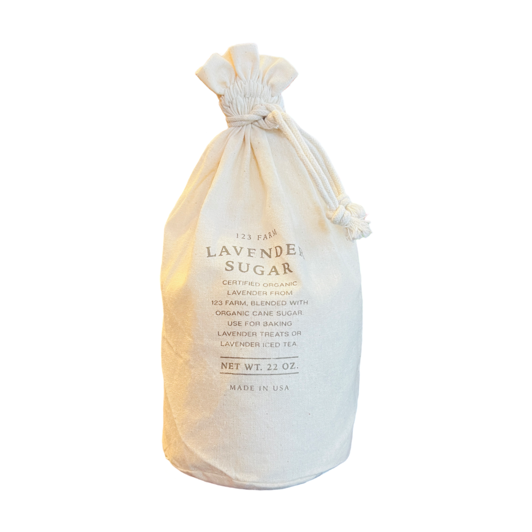 A rustic fabric bag labeled "Lavender Sugar" from 123 Farm, featuring organic lavender blended with organic cane sugar. 