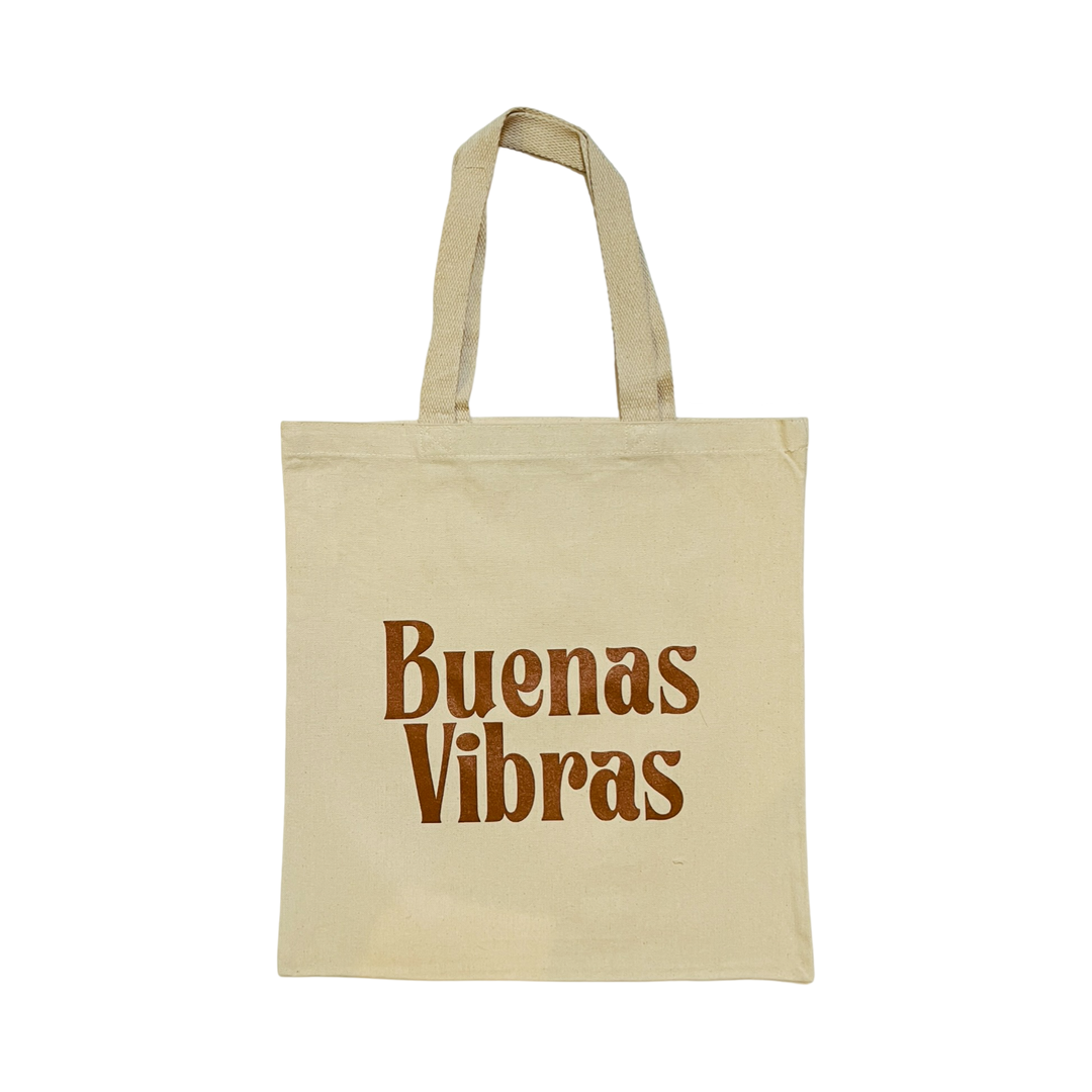 natural canvas tote bag with the phrase Buenas Vibras in brown lettering