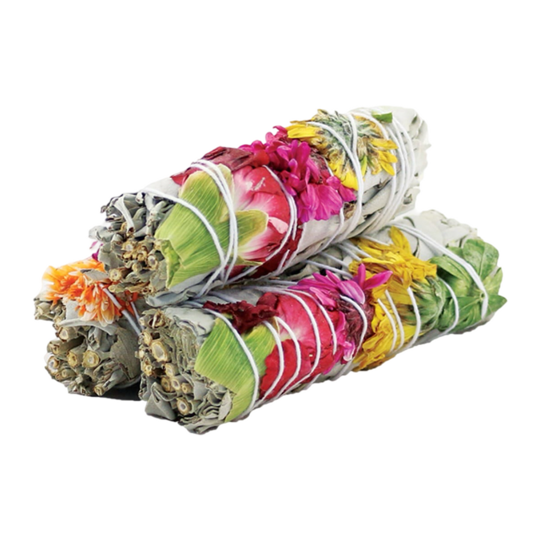 3 sage bundles with various colored flowers wrapped in white twine