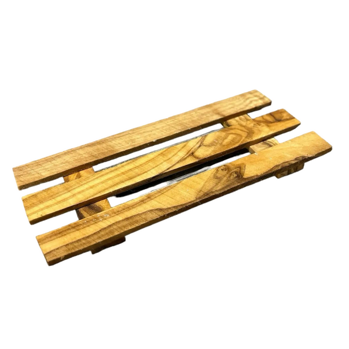 olive wood soap dish that consists of three wooden planks.