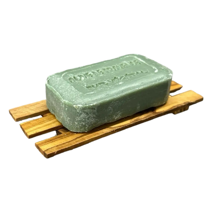 olive wood soap dish with a green bar of soap