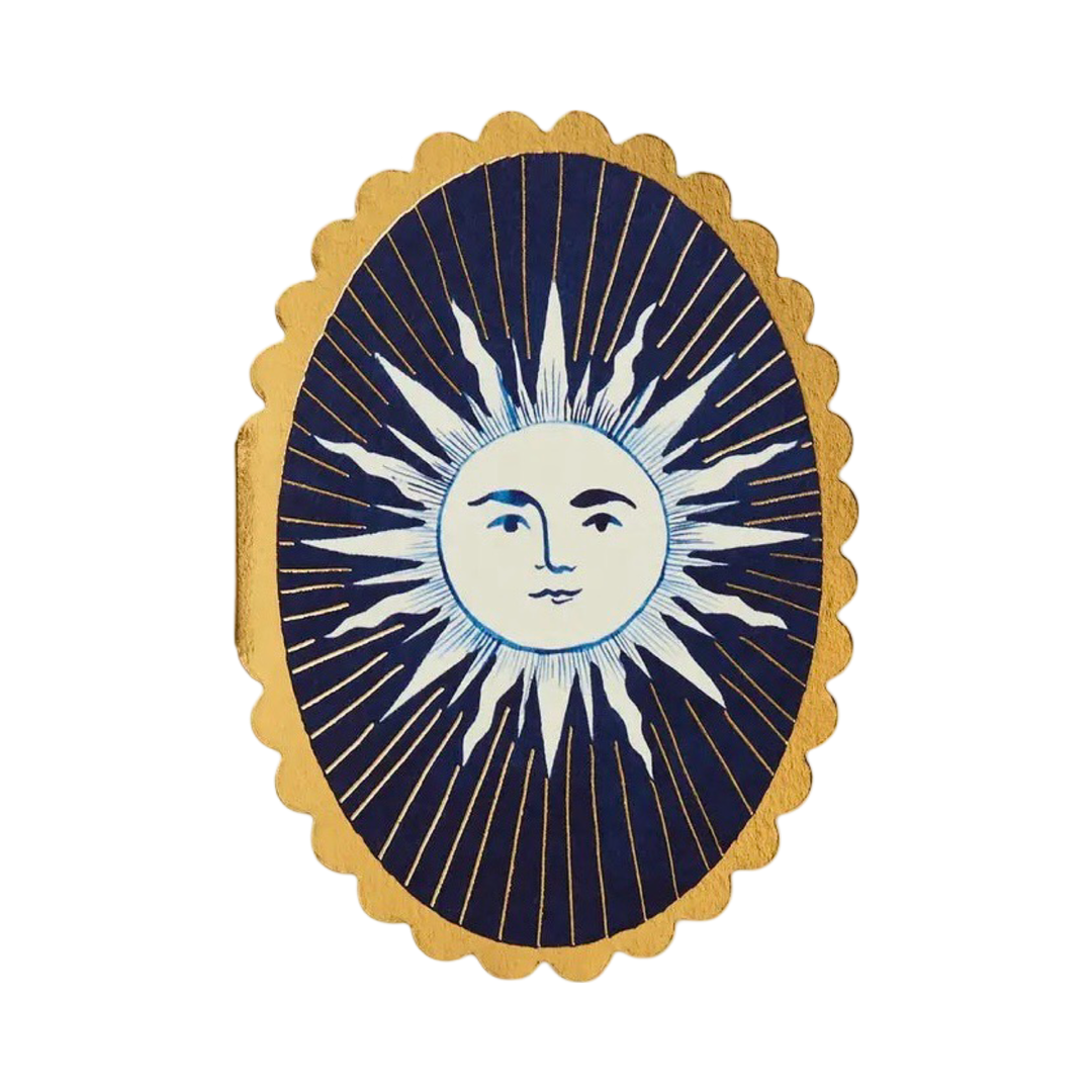 a oval blue card with a gold scalloped edge featuring a sun in the center