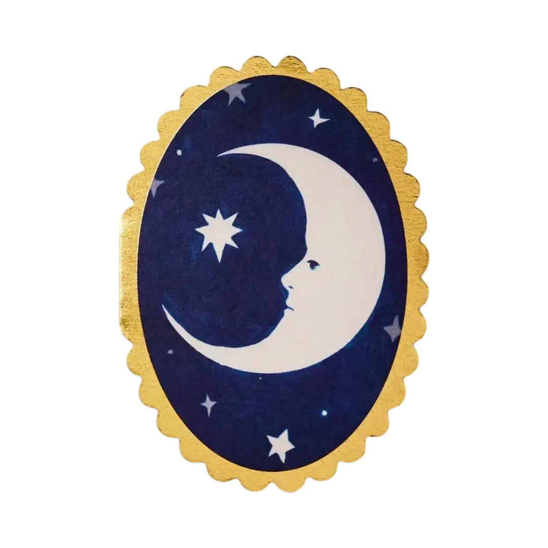 a oval blue card with a gold scalloped edge featuring a crescent moon in the center